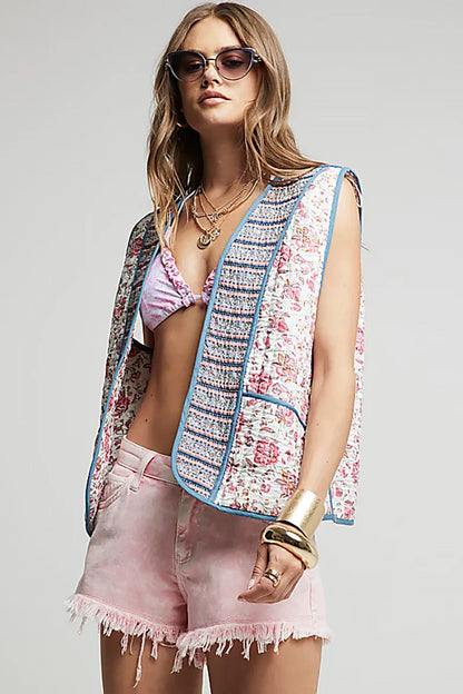 Mouwloos bloemenvest met geborduurde biezen