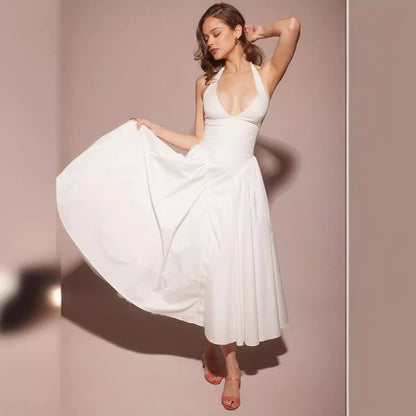 Chique halterjurk met wijde rok